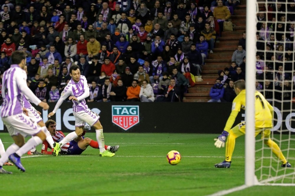 Griezmann stole the three points in a frantic finale. AFP