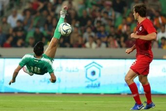 Amjad Attwan performs an overhead kick during the 2022 World Cup qualifier against Hong Kong. AFP