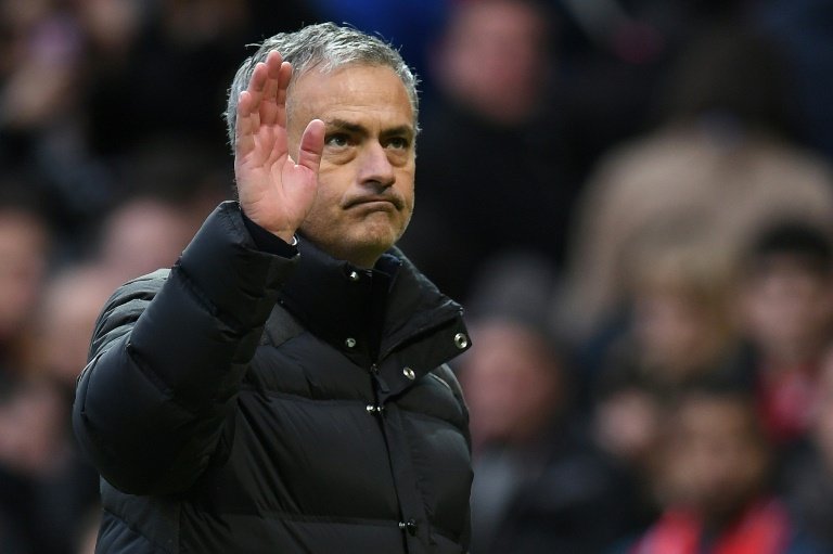 Jose Mourinho waves to fans following his sides 1-1 draw with Arsenal. AFP