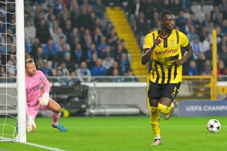 Serhou Guirassy (R) scored a penalty after coming off the bench against Brugge. AFP