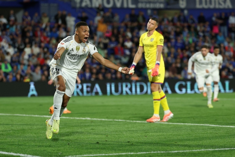 Mbappe sends Real Madrid top as Getafe self-destruct