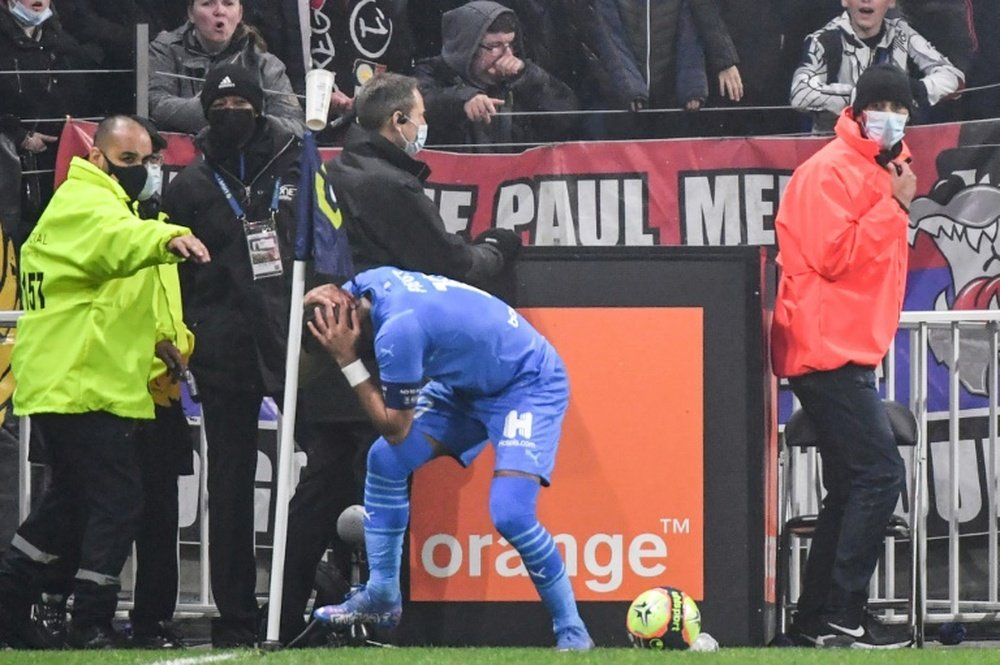 Dimitri Payet was struck on the head by a bottle of water. AFP