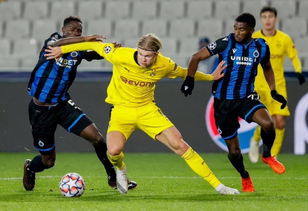 Borussia Dortmunds Erling Braut Haaland challenges Odilon Kossounou and Clinton Mata. AFP