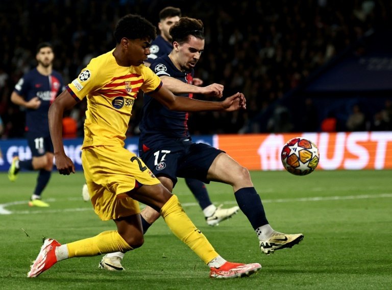 Lamine Yamal (L) has burst into the limelight this season with dynamic performances. AFP