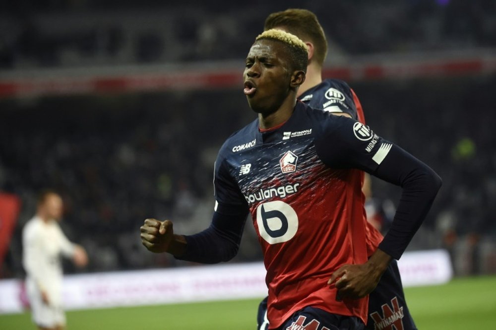 Lille up to third, Garcia's Lyon rout nine-man Nimes