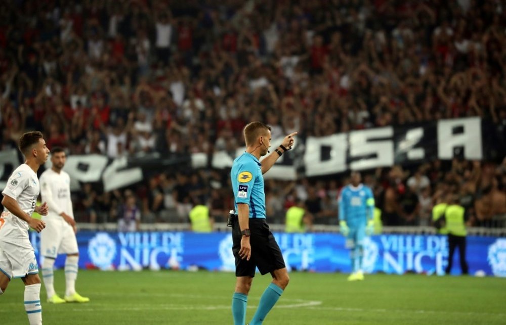 Ligue 1 match halted after Nice fans' homophobic chants.