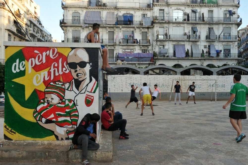 Algerians play football in Algiers Bab el-Oued neighbourhood, which is historically known to be a predominantly pro-Mouloudia Club Alger (MCA) area