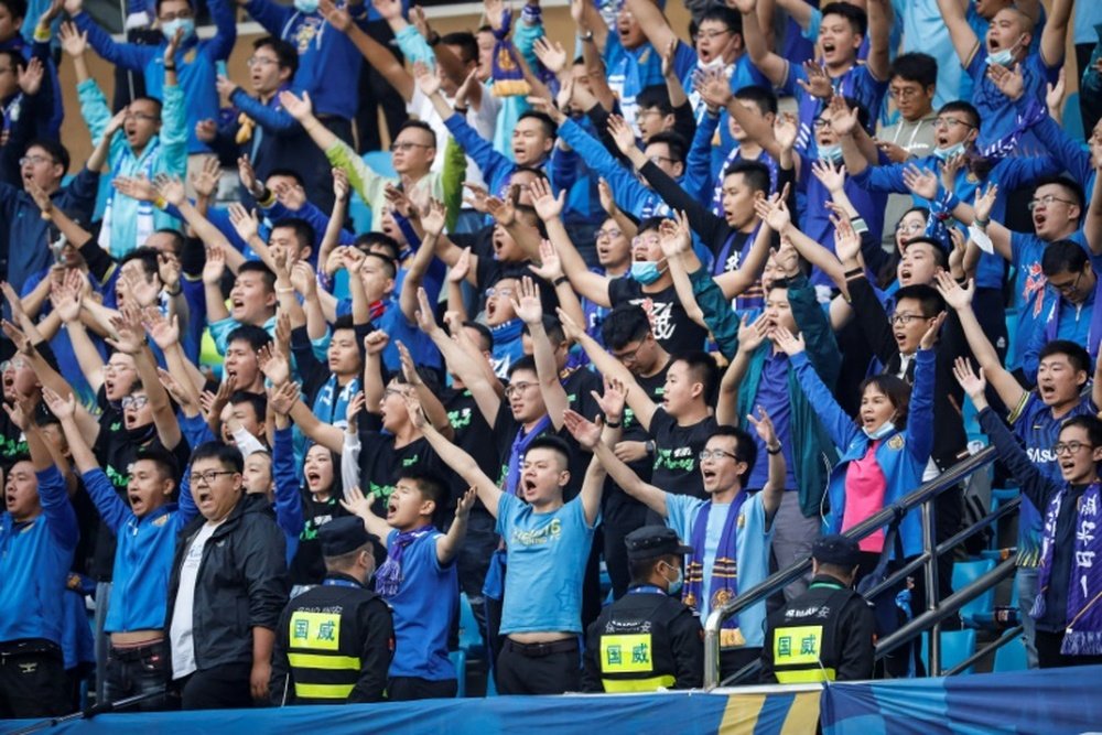 Fans of fallen Chinese football champions forced to suffer in silence
