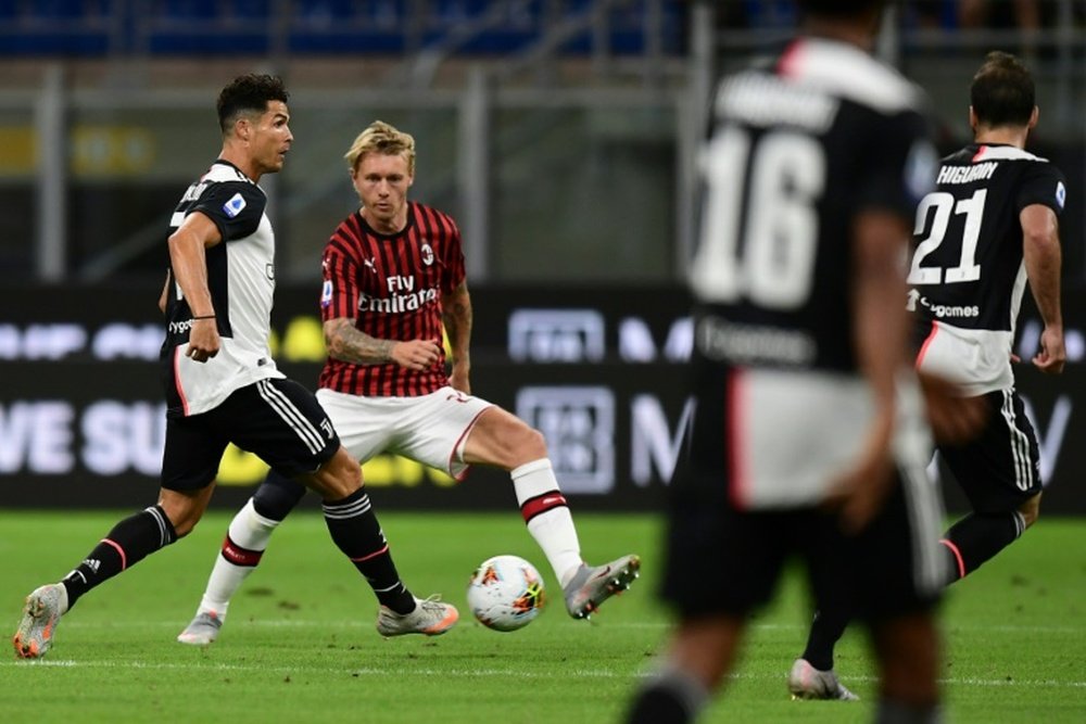 AC Milan take up option to buy Denmark skipper Kjaer. AFP