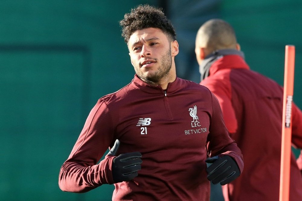 ALex Oxlade-Chamberlain is back on the Liverpool bench. AFP