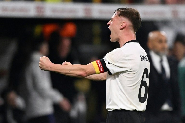 Germany survived a spirited second-half fightback from Italy, letting a three-goal lead slip to draw 3-3 in Dortmund on Sunday, before reaching the Nations League semi-finals 5-4 on aggregate.