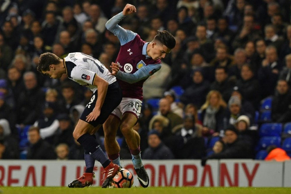 Grealish was floored by a pitch invader. AFP