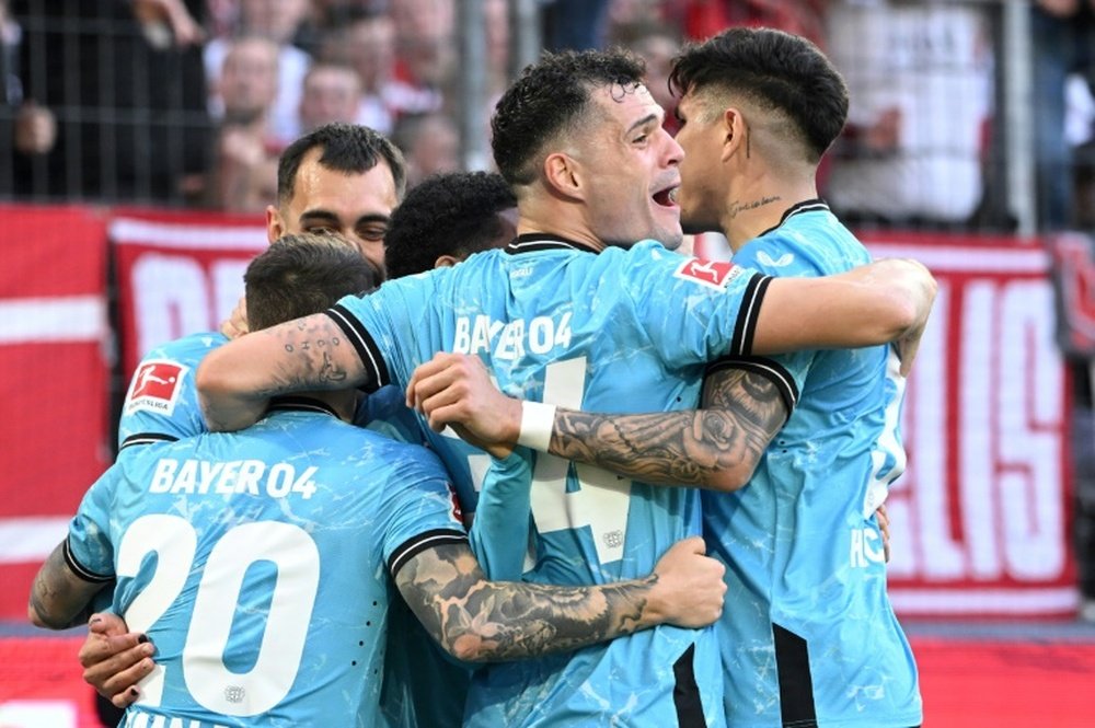 Leverkusen's Granit Xhaka (C) has been crucial in the club's push for a first ever league title. AFP