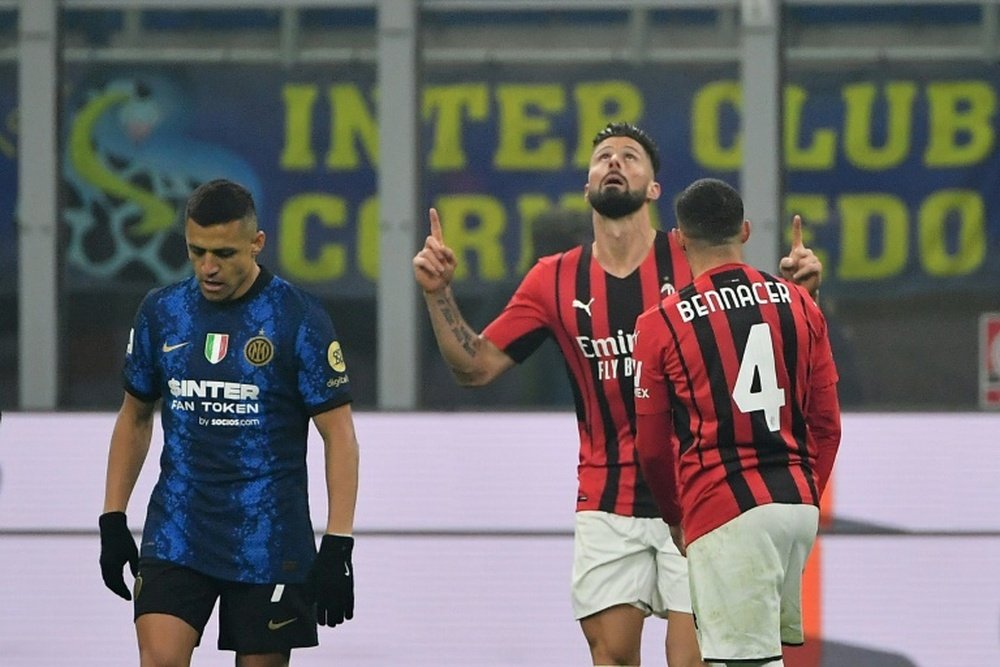 Olivier Giroud scored twice as Milan came from behind against Inter. AFP
