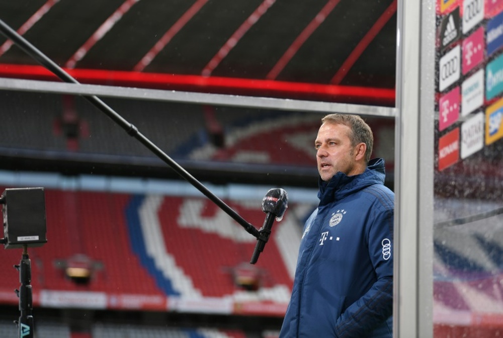 Bayern coach Flick bemoans lack of fans at 'special' Dortmund clash. AFP