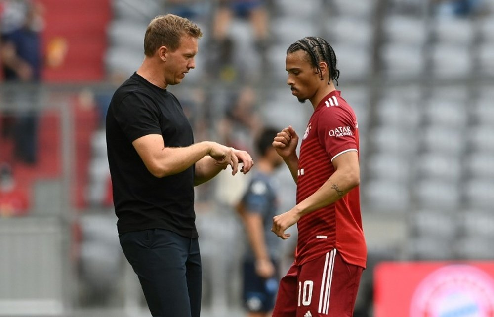 Julian Nagelsmann (L) believes Leroy Sane (R) plays better on the left. AFP