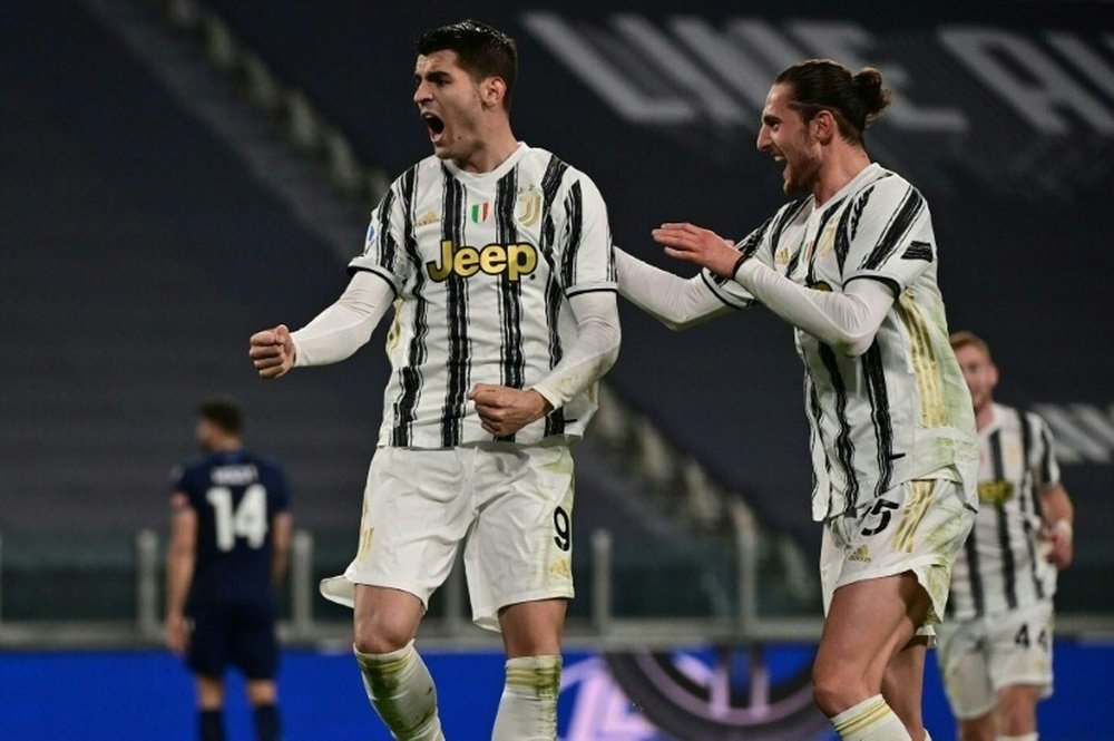 Alvaro Morata (L) got two goals and an assist in Juve's 3-1 win v Lazio. AFP