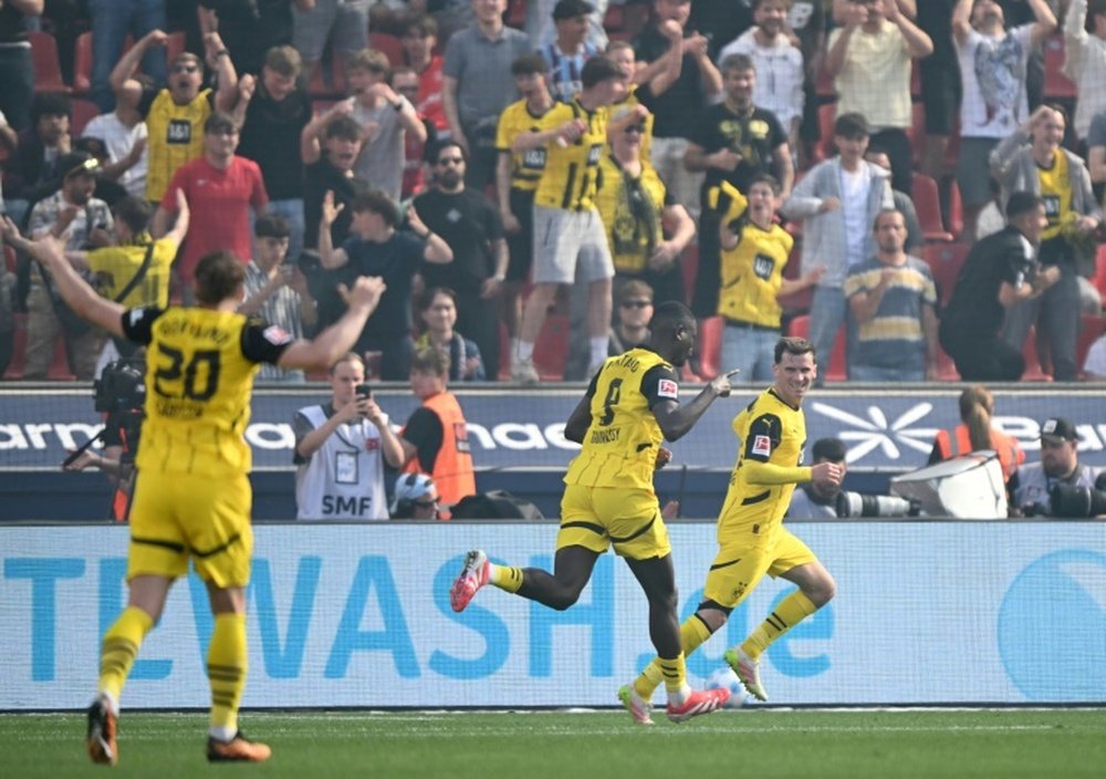 Guirassy scored Dortmunds fourth goal at Leverkusen. AFP