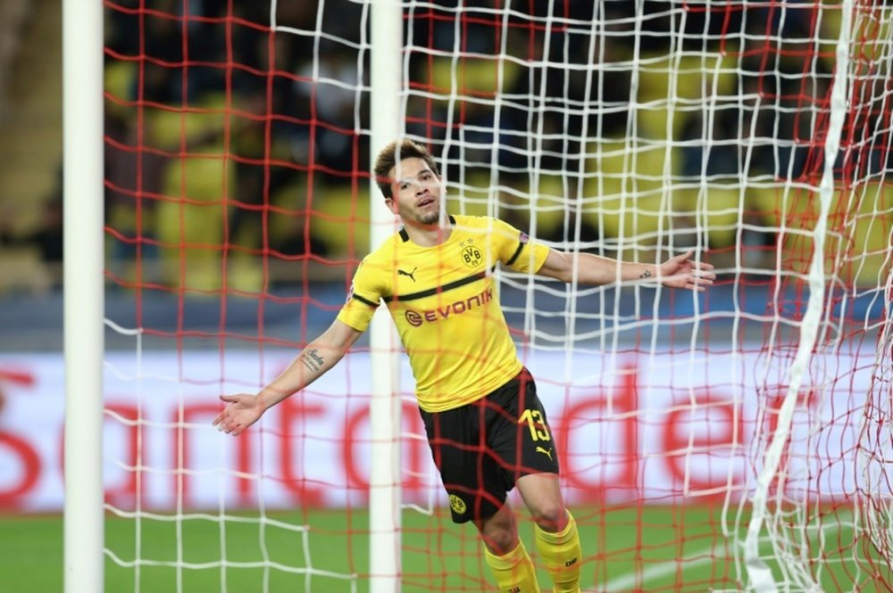 Guerreiro scored twice to secure top spot for Dortmund. AFP