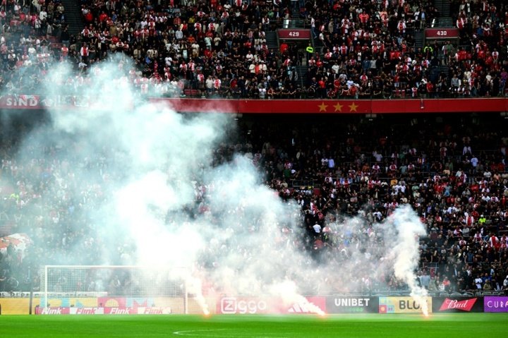 Ajax v Feyenoord abandoned after flares lobbed on field