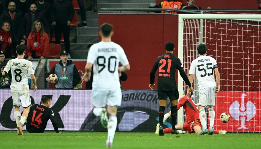 Leverkusen forward Patrik Schick (2L) kept his side's dream alive. AFP