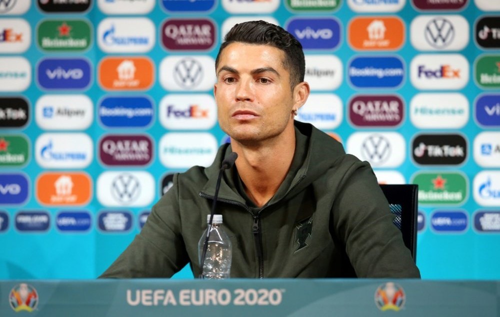 Ronaldo removed a Coca-Cola bottle in a Portugal press conference. AFP