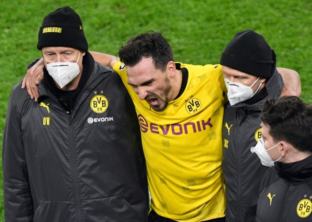 Mats Hummels (C) has shaken off an ankle injury suffered against Lazio. AFP