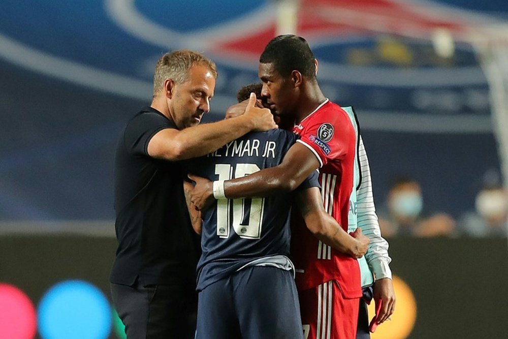 David Alaba (R) has been urged to renew at Bayern Munich. AFP