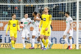 Noah Sarenren Bazee (C) got Augsburg a leveller against Dortmund. AFP