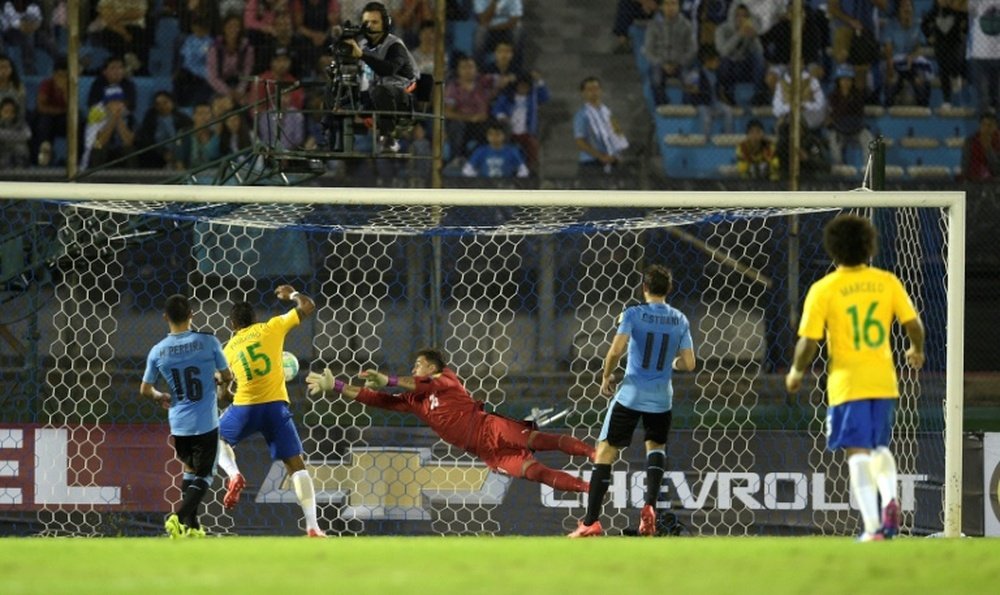 Paulinho (2nd-L) scores the second of his three goals as Brazil thrash Uruguay 4-1