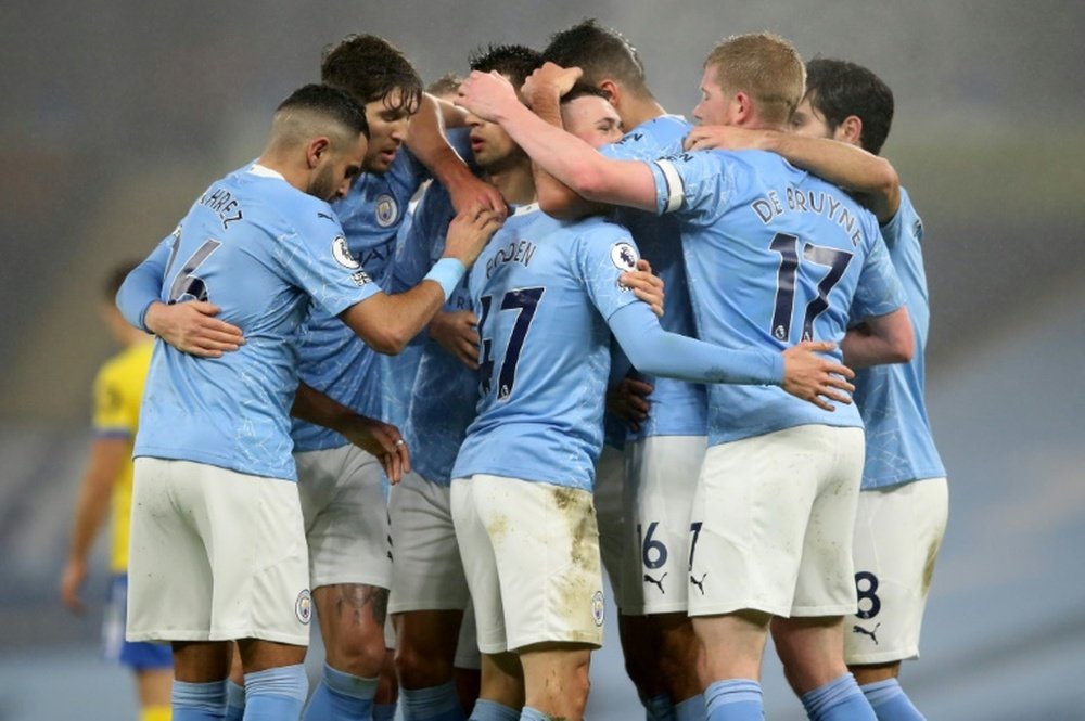 Manchester City celebrate Phil Fodens goal against Brighton. AFP