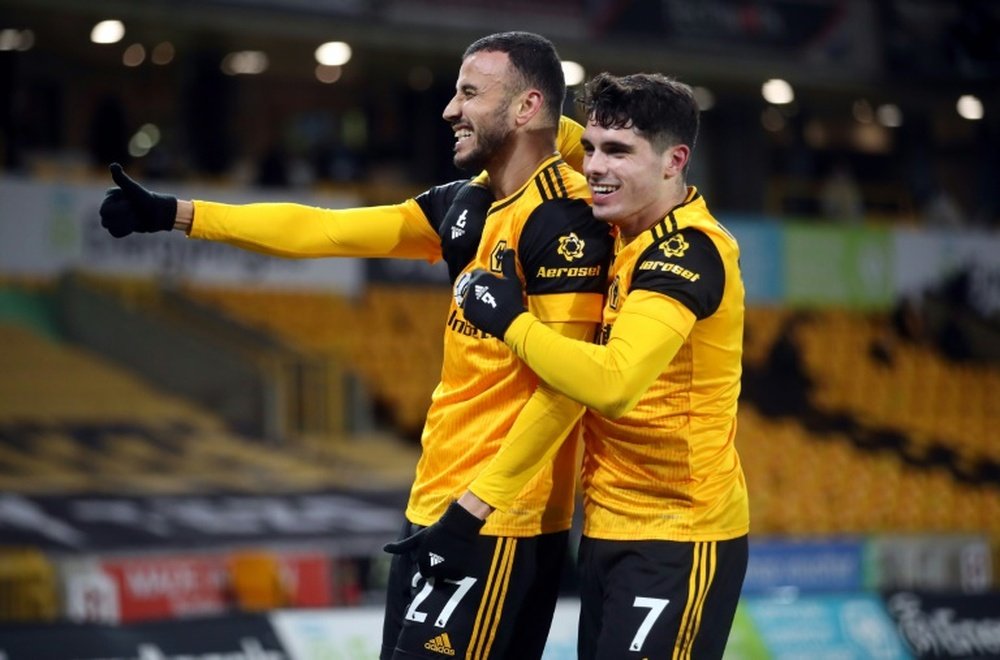 Romain Saiss (L) got Wolves a deserved draw at home to Tottenham. AFP