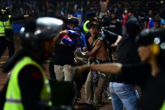 Two Indonesian football teams whose last game ended in one of the deadliest disasters in the sport's history met again under heavy security and without spectators.