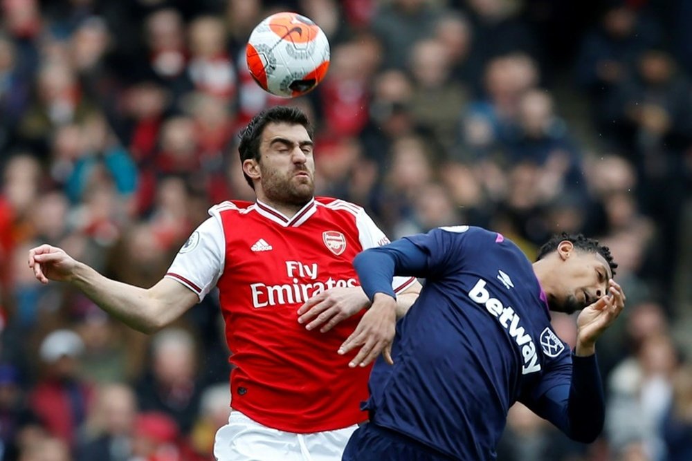 Sokratis Papastathopoulos (L) has left Arsenal six months earlier than planned. AFP