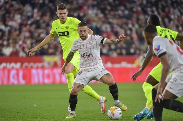 ï»¿Gomez conjures up Sevilla win to preserve stress on Real Madrid