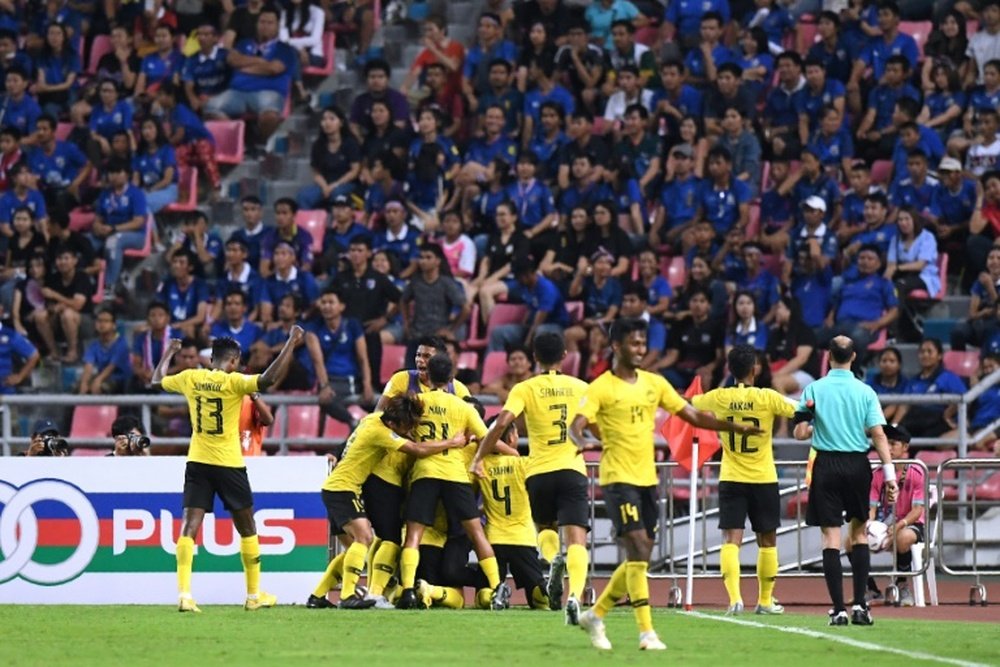 The away supporters were soon celebrating as Malaysia drew level before the half-hour. AFP