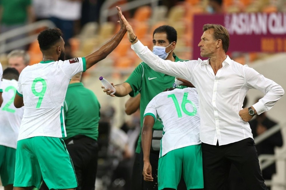 High-five for Saudi scorer Firas al-Buraikan from coach Herve Renard. AFP