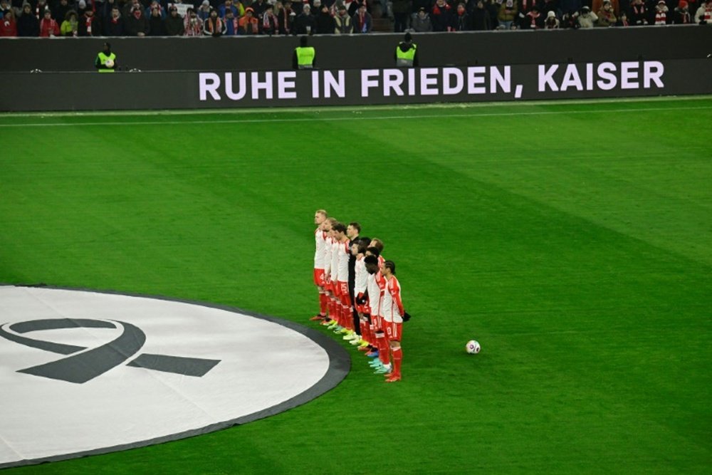 Bayern's players observed a moment of silence in honour of late Beckenbauer. AFP