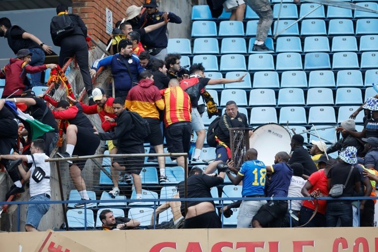 Mamelodi Sundowns of South Africa edged Esperance of Tunisia 1-0 on Tuesday in a CAF Champions League quarter-final first leg marred by post-match crowd violence.