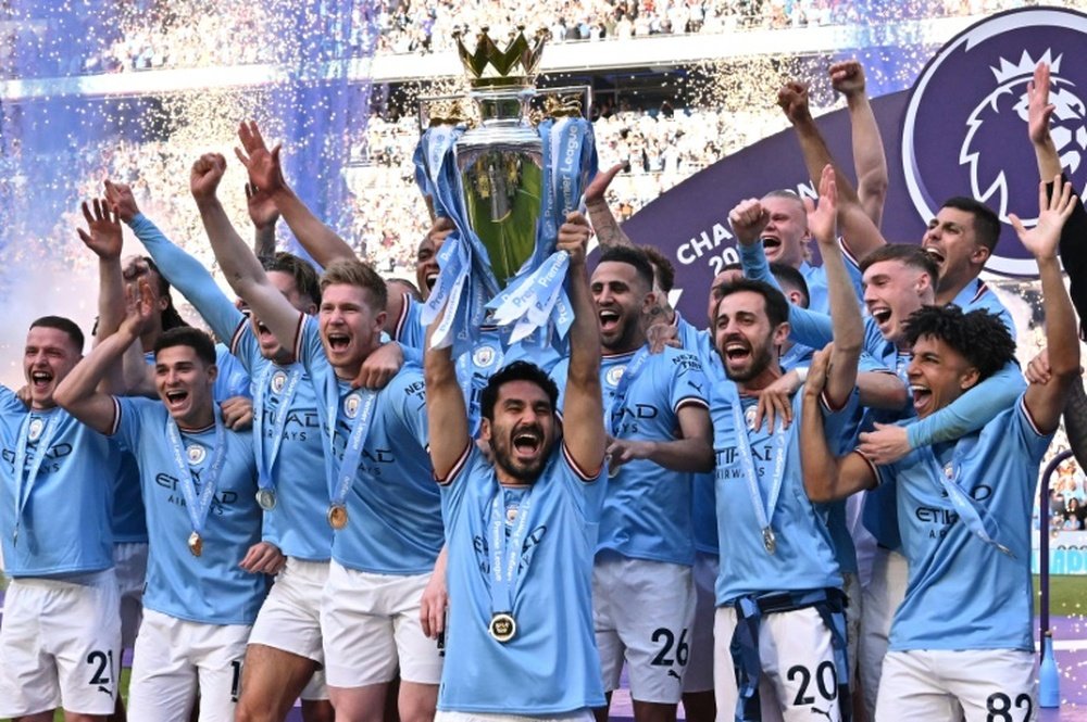 Man City are two wins away from winning the treble. AFP