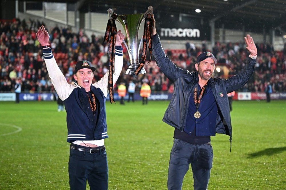 McElhenney and Reynolds lifted the National League trophy. AFP