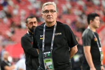 Branko Ivankovic's reign as China coach got off to a disappointing start as they squandered a two-goal lead to draw 2-2 at Singapore in a World Cup qualifier on Thursday.