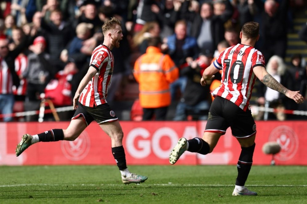 Doyle (L) scored a stoppage time winner to send Sheffield United into the FA Cup semi-finals. AFP