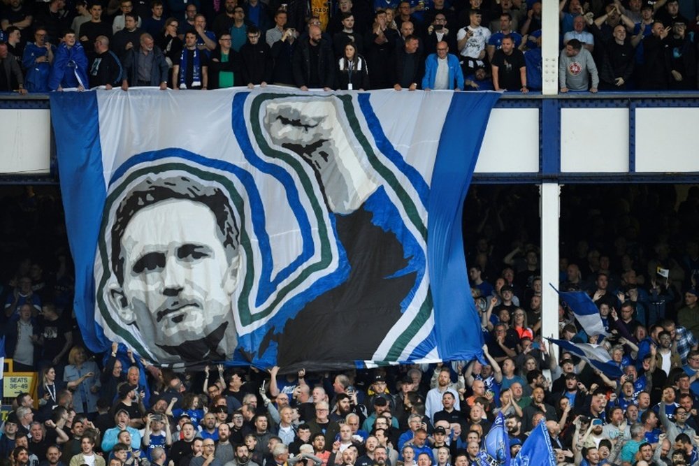 Everton supporters hold a banner of manager Frank Lampard. AFP
