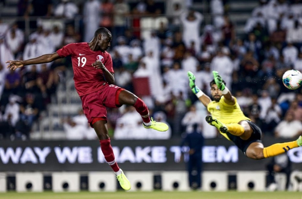 Ali (L) helped Qatar thrash Afghanistan in World Cup qualifying. AFP