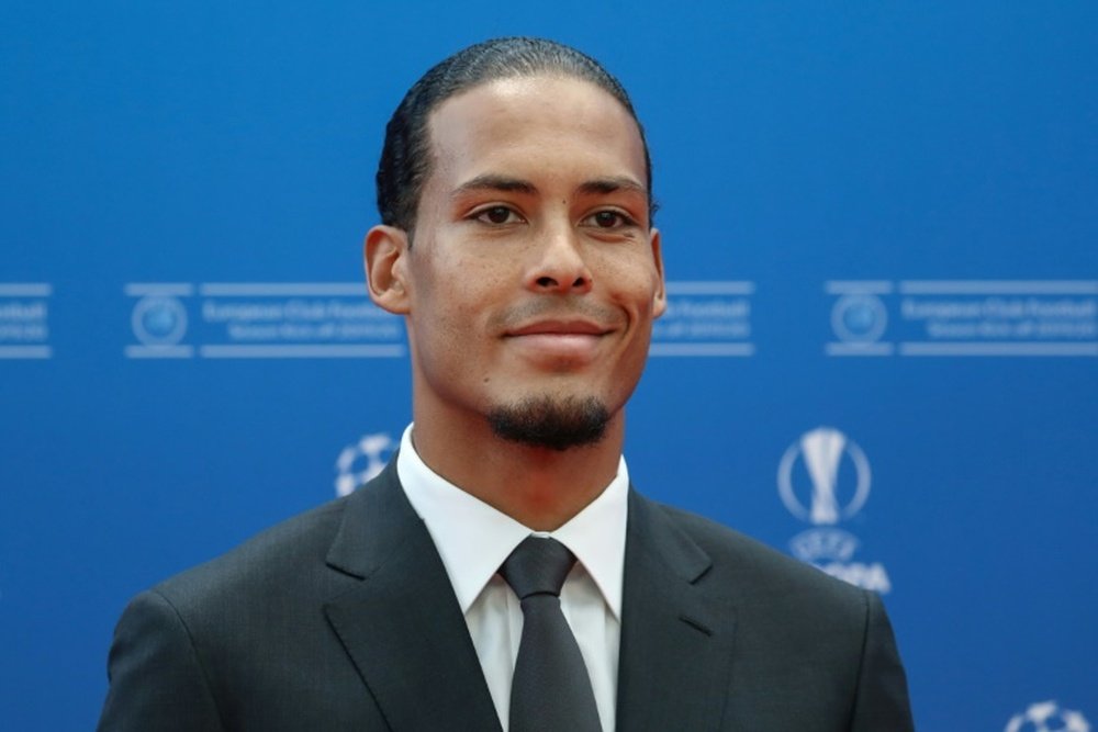 Van Dijk became the first defender to win the award. AFP