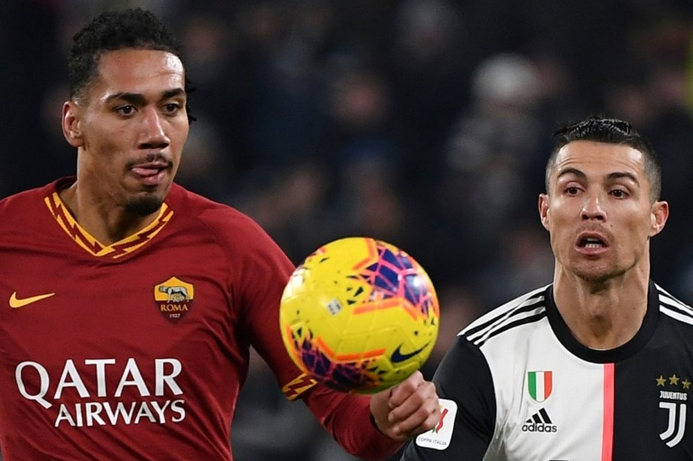 Smalling has signed for Roma. AFP