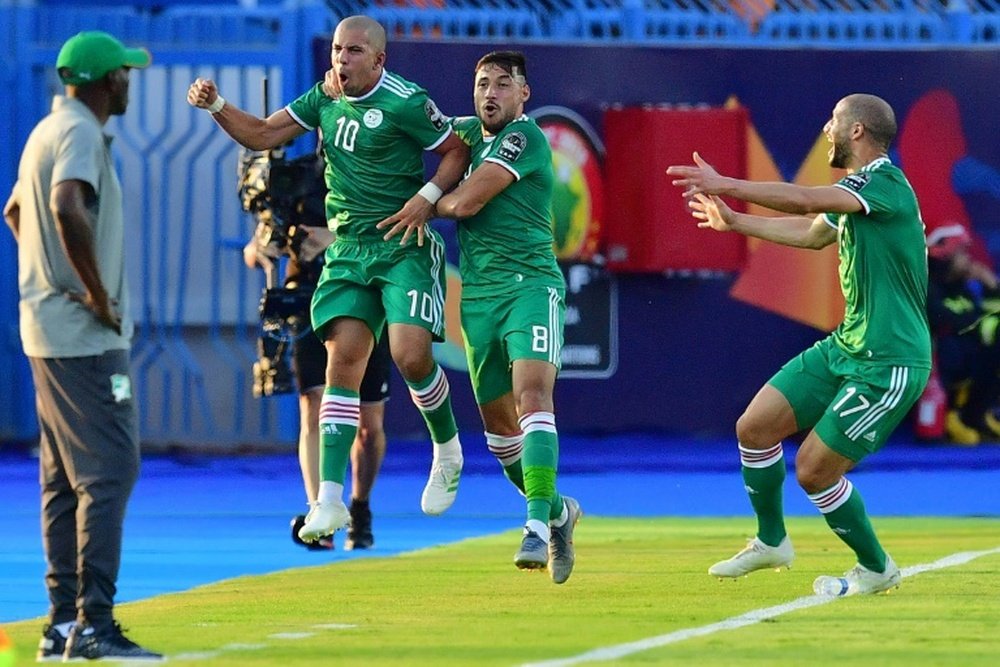 Feghouli (2L) scored Algeria's goal in their penalty shootout victory. AFP