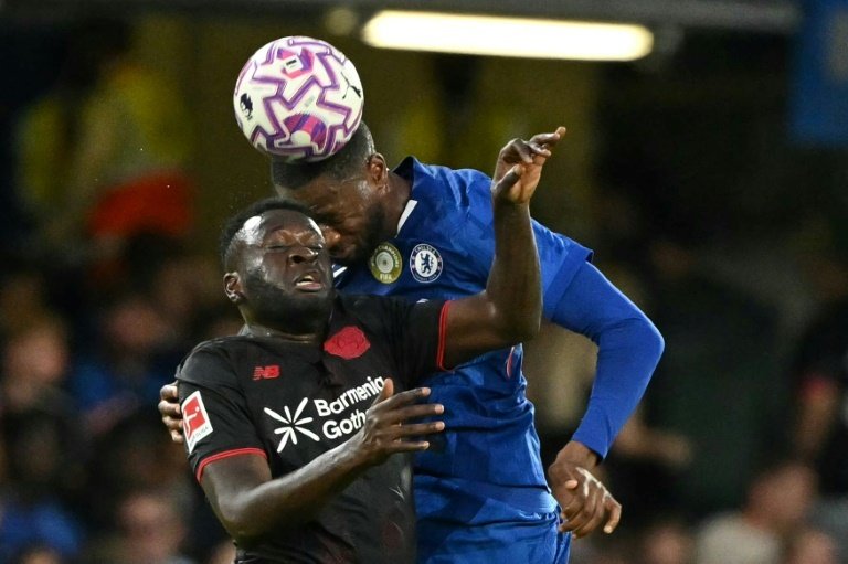 Boniface (L) played a key role up front as Leverkusen claimed an unbeaten double in 2023/24. AFP
