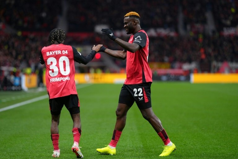 Bayer Leverkusen move within six points of Bundesliga leaders Bayern. AFP